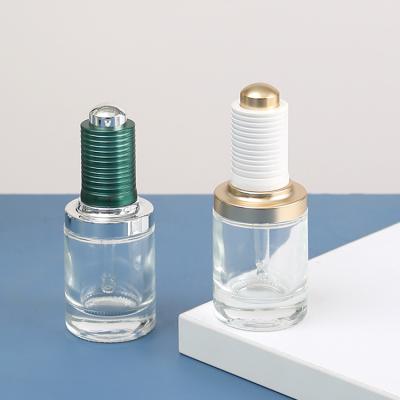 China 30-50ml Round Clear Dropper Glass Skin Care Oil Bottle with White Push Dropper Assembled Dropper for sale