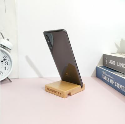 China Creative home mobile phone wooden bendable wood stand office restaurant hotel cell phone holder for sale