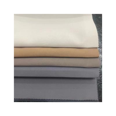 China Blackout Passing M1 Inherent Flame Retardant Room Darkening Triple Woven Plain Blackout Fabric for sale