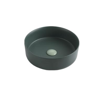 China Modern Ceramic Art Basin Made Of Porcelain Round Waist Basin Wash Basin Colored Built-In Bathroom Sink for sale