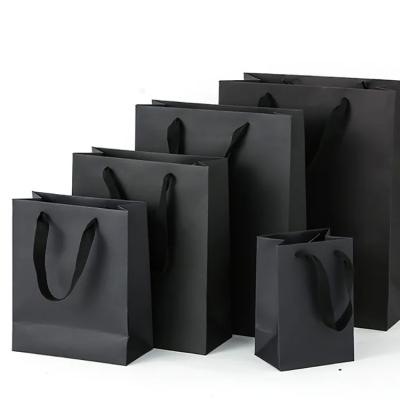 China Custom Logo Large Black Matte Laminated Paper Shopping Tote Product Bags for Clothing Store with Your Own Logo for sale