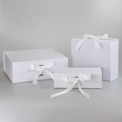 China wholesale price luxury magnetic foldable folding box white folding electronic boxes with ribbon bow for sale