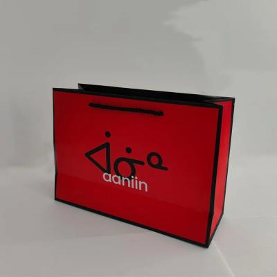 China Oem golden supplier personalize eco-friendly recycled boutique red paper packaging bags with handle and logo for sale