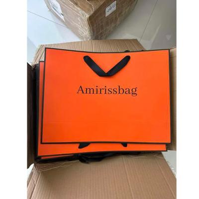 China Embalaje de regalo personalizado bolso de papel de embalaje naranja embalaje personalizado embalaje artesanal bolsas de papel portátil naranja con logotipo personalizado en venta