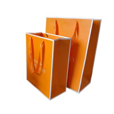 China Luxury Design Laranja Impresso Large Satin Handle Acessórios de Moda Bolsas de mão Bolsas de papel personalizadas Bolsa de compras com logotipo à venda