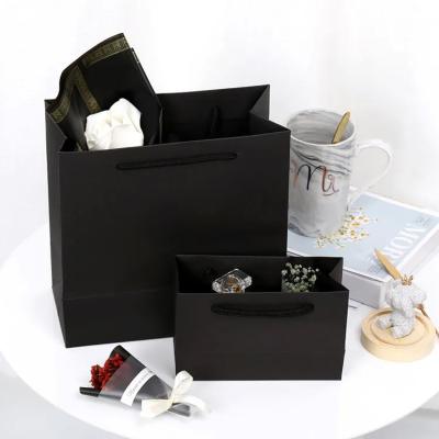 China New Arrivals Paperbag Luxury Color Black Cardboard Goodies Business Gift Packaging Bag Custom Made Logo for sale