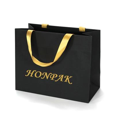 China Custom Private Hot Stamping Foil Gold Logo Printed Small Black Bag Luxury Boutique Clothing Store Shopping Paper Gift Bags for sale