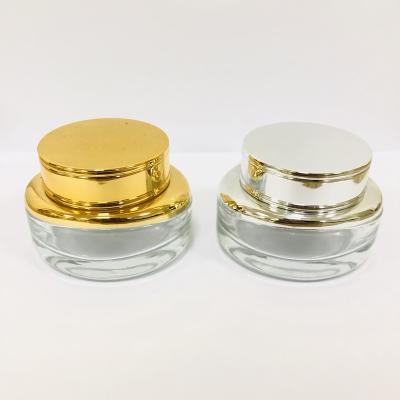 China Personal Care OEM Customization Personal Skin Care Stylish Logo Printing Round Cream Glass Jar 50ml for sale