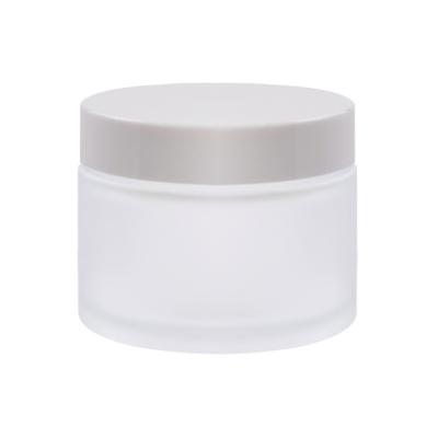 China Personal Care OEM Customization Personal Skin Care Stylish Logo Printing Round Cream Glass Jar 50ml for sale