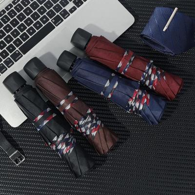 China 10K Umbrella Large Side Envelope Business Modern Simple Folding Umbrella Man And Sunny Printed Logo Three Folding Umbrella for sale