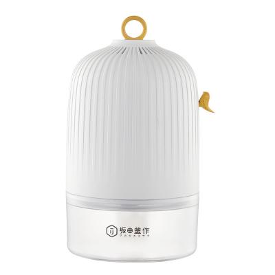 China New Home White Small Portable Household Bedroom 4L Dehumidifier Dryer Humidifier With Removable Water Tank for sale