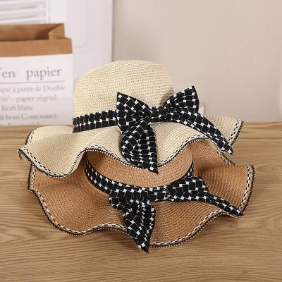 China Foldable and easy to carry bow summer new arrivals lady's topee sunscreen control bel foldable straw hat for sale