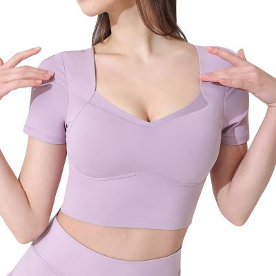 China Breathable Women Mesh Insert Compression Elastic Quick Yoga Dry T-Shirt With Pads for sale