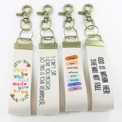 China Wholesale Custom Luxury Cotton Wristband Logo Graphics Print Wrist Strap Key Chain Cotton+polyester Metal Key Chain for sale