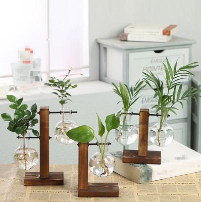 China Nordic Simple Home Decor Eco-friendly Tabletop Wooden Base With Transparent Glass Vases for sale