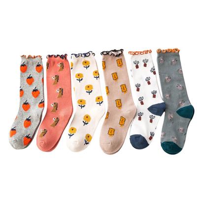 China Low Price Breathable College Style Loosely Say Jacquard Tube Girl Boys Cotton Cartoon Kids Long Lip Socks for sale