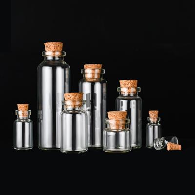 China Small Bottles Empty Sample Vials Clear Glass Bottles With Corks Jars for sale