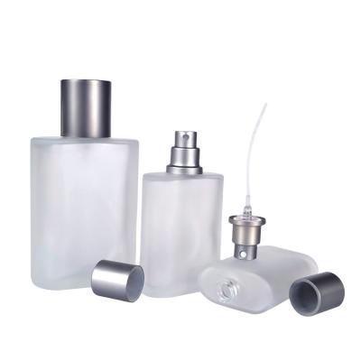 China Beautiful 30ml 50ml 100ml oblate square Frosted glass perfume bottles with PUMP SPRAYER cap for sale