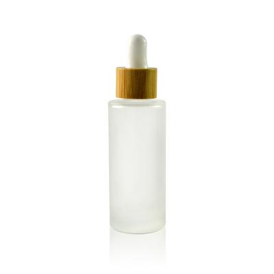 China Essential oil 5ml 10ml 15ml 20ml 30ml 50ml 100ml frosted glass dropper bottle with bamboo cap for sale