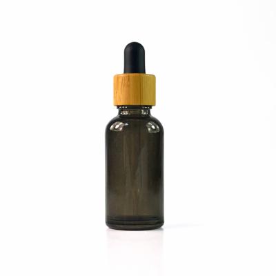 China 20ml e liquid black frosted glass dropper bottle with bamboo and glass pipette for sale