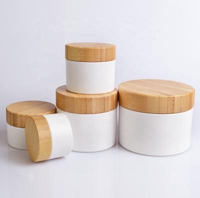 China Luxury cosmetic 20g 30g 50g 100g 150g PP plastic skin care cream jar with bamboo wood cap for sale