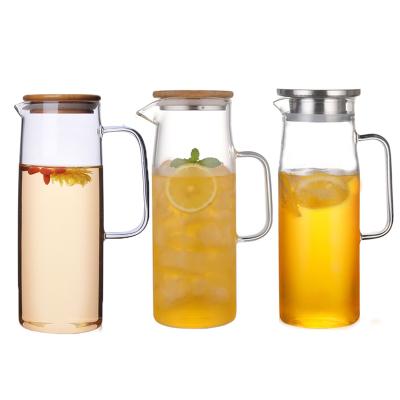 China Viable Wholesale Handmade Borosilicate Drinking Glass Water Pitcher Heat Resistant Jug With Filter Lid for sale