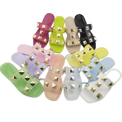 China CUSHIONING Lady Flat Plastic Sandals Freeze Shoes Rivet Slippers for sale