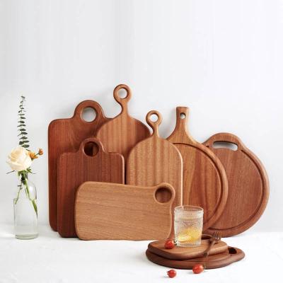 China Sustainable Professional Wooden Walnut Chopper With Hole For Kitchen Wall Mount for sale