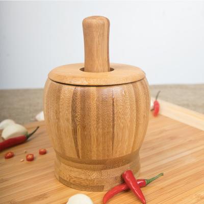 China Sustainable hot sale eco-friendly bamboo wooden manual garlic crusher garlic pressing tool for sale