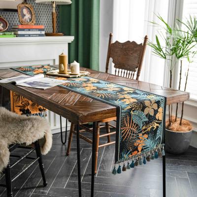 China Luxury retro geometric style table runner luxury forest leaves jacquard polyester flower tassels table runner for sale