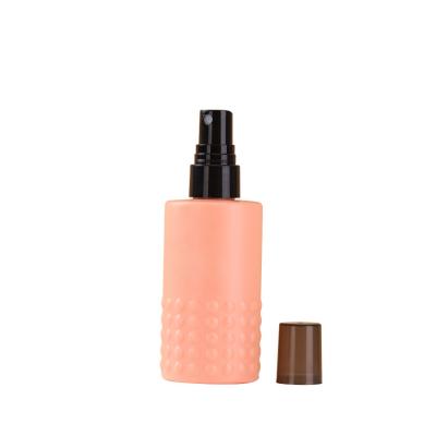 China Personal Skin Care Packaging Cylindrical Flat Shoulder With Matte Pink Hair Pad Dots HDPE 100ml Essential Toner Spray Bottle With Black Cap for sale