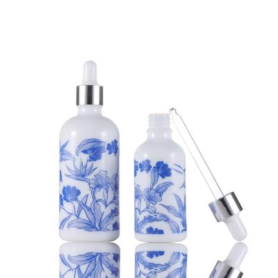 China Free Sample 10ml 15ml 30ml 50ml 100ml Cosmetic Ceramic Oil Dropper Bottles For Essential Oils White Opal Bottle With Printing for sale