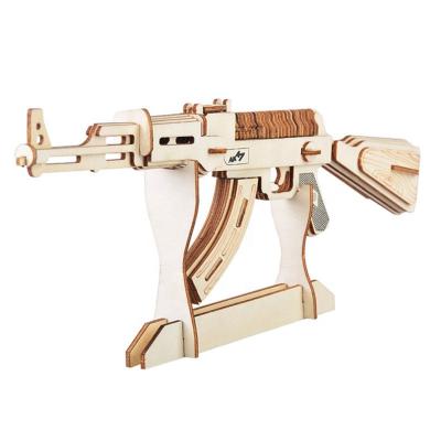 China Eco-friendly laser cutting novelty items for kidstoys puzzle3d wooden gun puzzle block for sale