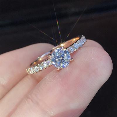 China Cute Engagement Ring Gold Plating Women Rings Zircon Ring Latest Design Shiny Round Wedding for sale