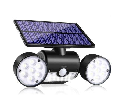 China Outdoor Solar Garden Lights 30 LED Solar Security Lights with Motion Sensor Head Spotlights Waterproof Solar IP44 Light for sale