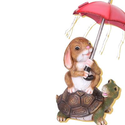 China Europe Solar Garden Statue Outdoor Decor, Rabbit Sitting on Turtle Holding Umbrella with String Lights, Easter Bunny Statue for Patio for sale