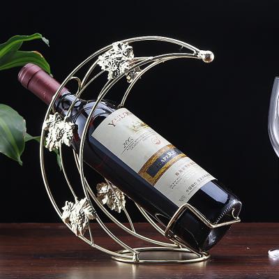 China ChinaManufacture Competitive Price Small Moon Wine Rack Iron Wine Stand Red Wine Rack for sale