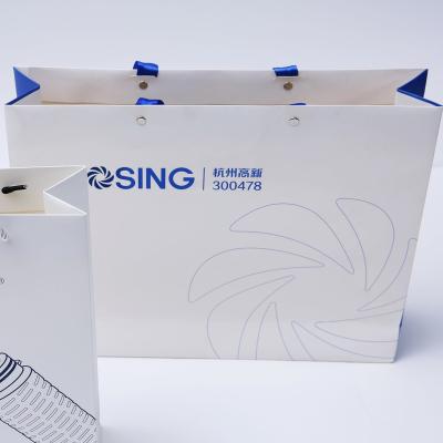 China Custom Recyclable Logo Paper Bag Manufacturing Printed Cardboard Paper Gift Bag With Ribbon Handle for sale