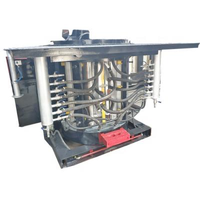 China Factory 2 Ton Steel Case Braces Electric Induction Hydraulic Tilting Iron Melting Furnace en venta