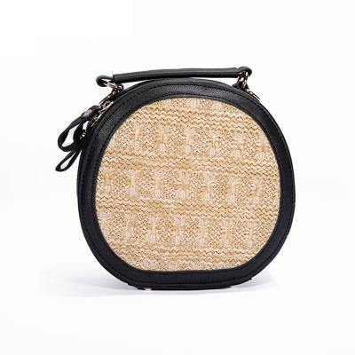 China 2021 High Quality New Fashion Girls Summer French Pink Round Straw Bag Handmade Small Woven Bucket Pockets Vintage PU Leather Chain Shoulder for sale