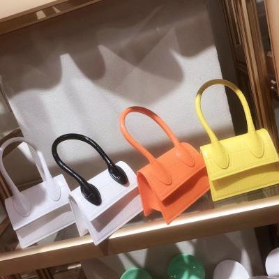 China Waterproof 2021 Mini Jelly Purse Kid Jelly Handbags Candy Color Contrast Color PVC Handbags For Women For Kids for sale