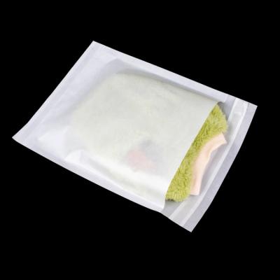 China Recycled Materials Custom Glassine Paper Clothing Bag 100% Recyclable Pure E-friendly Biodegradable Garment Paper Packaging Bags for sale