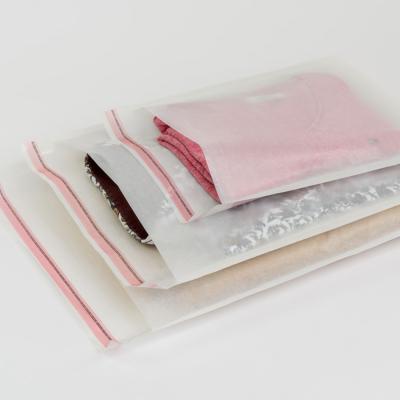 China Recycled Materials Custom 100% Biodegradable Glassine Paper Self Seal Packaging Bags For Clothing for sale