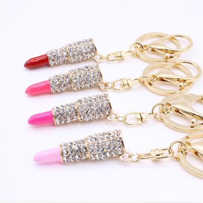 China Rhinestone Hard Lipstick Metal Feeling Touch Key Chain For Key Chain Bag Woman Pendant Gift for sale