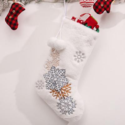 China Christmas Decoration Supplies Snowflakes Embroidered White Plush Christmas Stocking Candy Socks Gifts Bag With Hanging Bows Christmas Tree Fireplace Decorations for sale