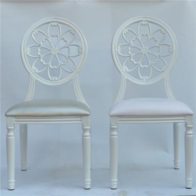 China Hotel Chair French Style Modern White Silver Cut Out Round Back Stacking Wedding Louis Banquet Dinning Chair for sale