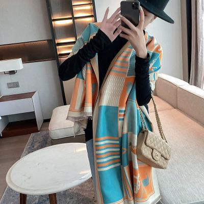 China 2023 European and American spring style tassel double-sided cashmere scarf women's street bib warm double-sided shawl for sale