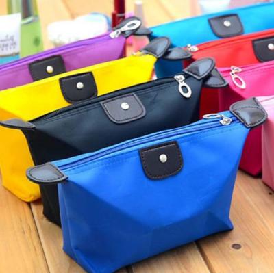 China Wholesale Korean Cute Cosmetic Candy Color Dumpling Bag Yuanbao Storage Toiletry Bag Waterproof Fashion Dumpling Bag Folding Bag for sale