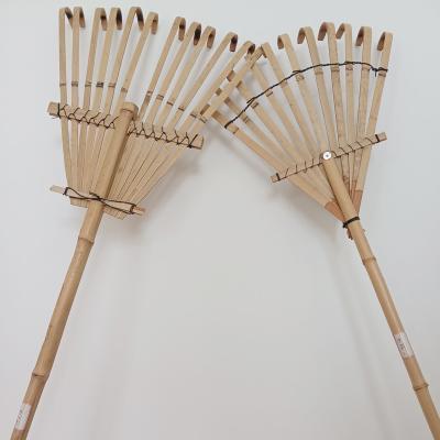 China Farm Tool Bamboo Frame Leaf Collector Concrete Garden Leaf Rake for sale