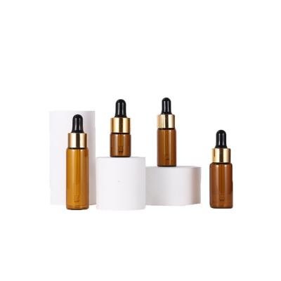 China Chemical Glass Bottles For Essential Oils , 10ml Empty Refillable Amber Bottle Carrier Oil Kit With Dropper And Orifice Reducer Cap for sale